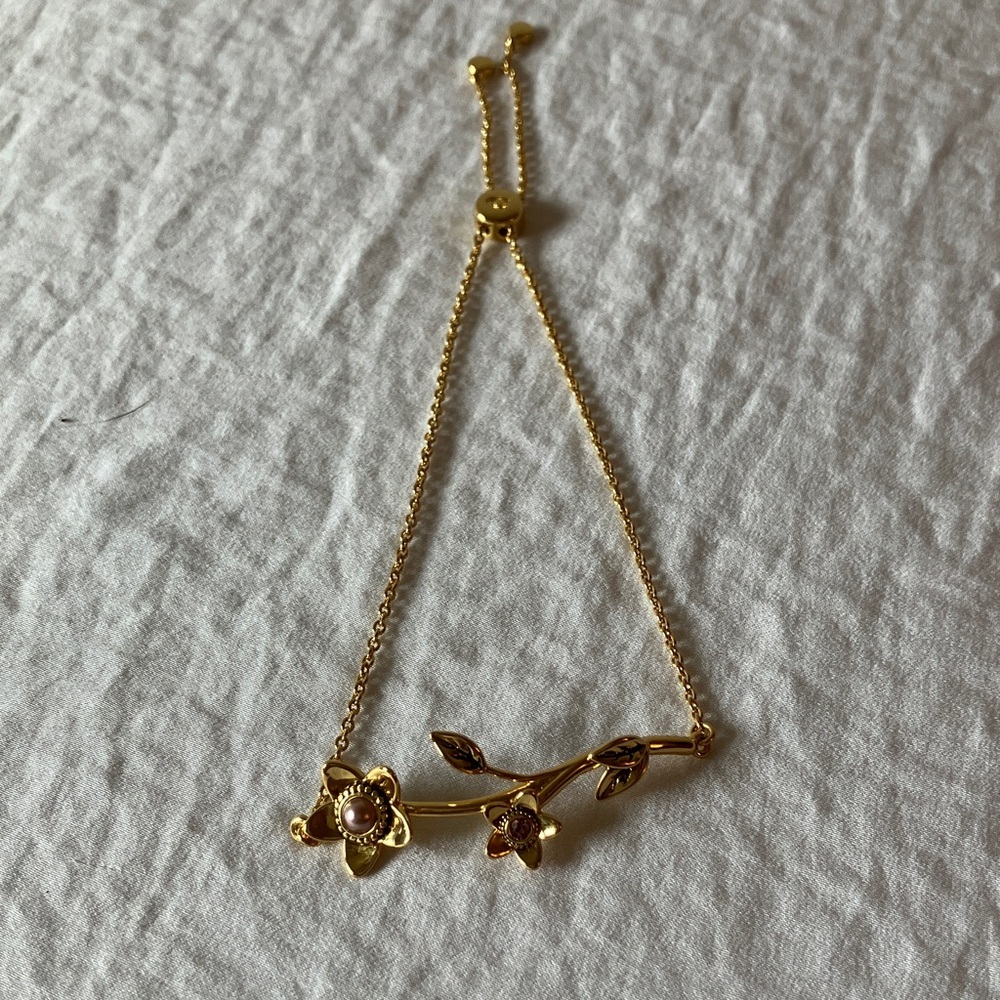 Coach: Gold Tone Cherry Blossom Slider Bracelet